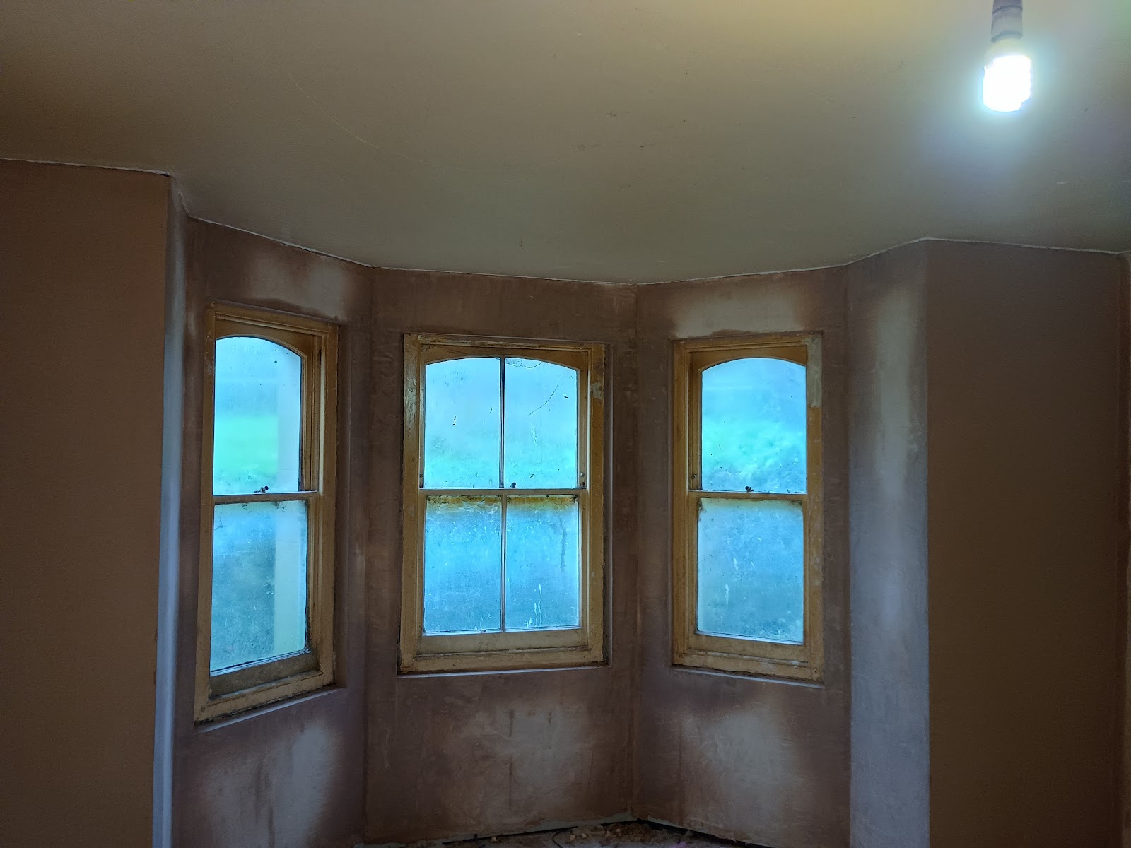 A curved bay window replastered in a period Ipswich home